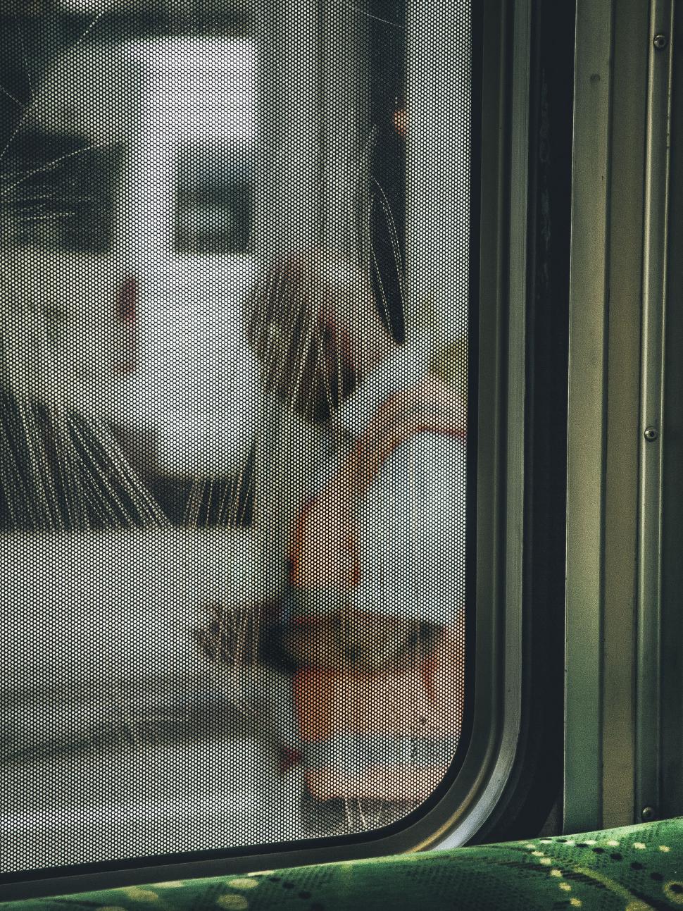 Free Image of Artistic view through a window of a city bus 