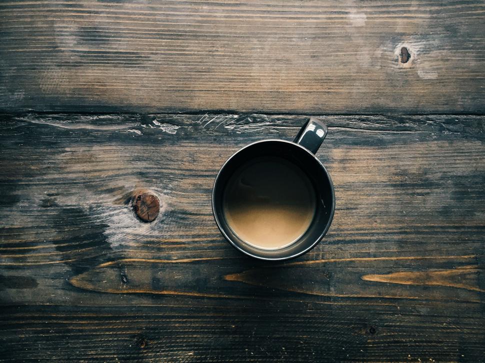 Free Image of Top view of coffee mug on rustic wood 
