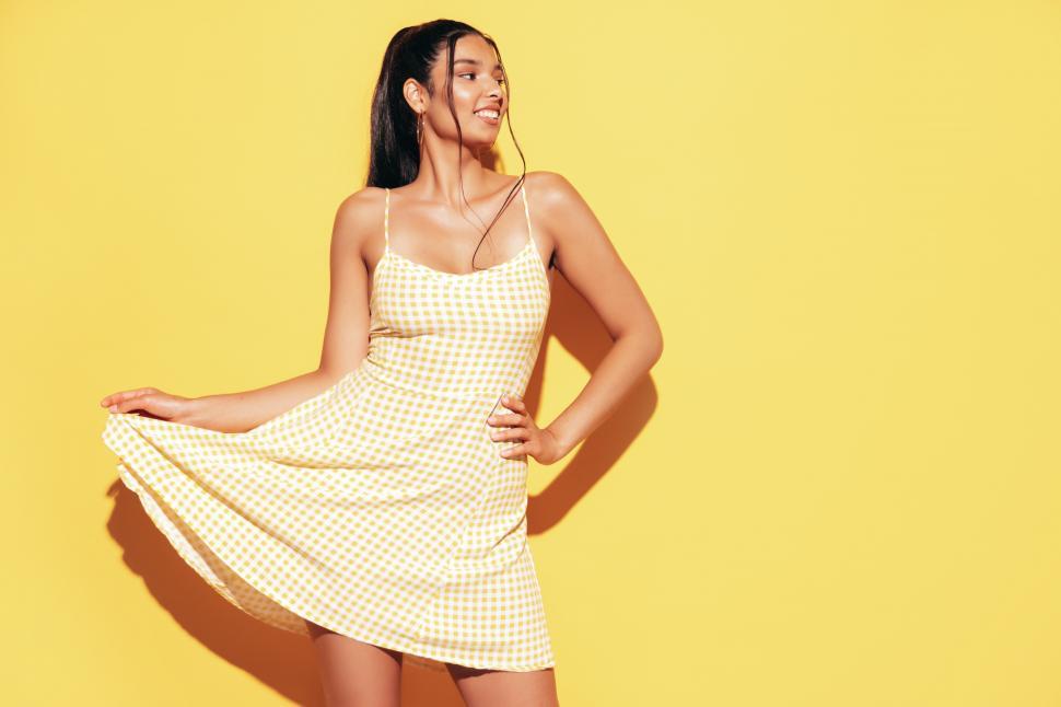 Free Image of A woman in a yellow dress 