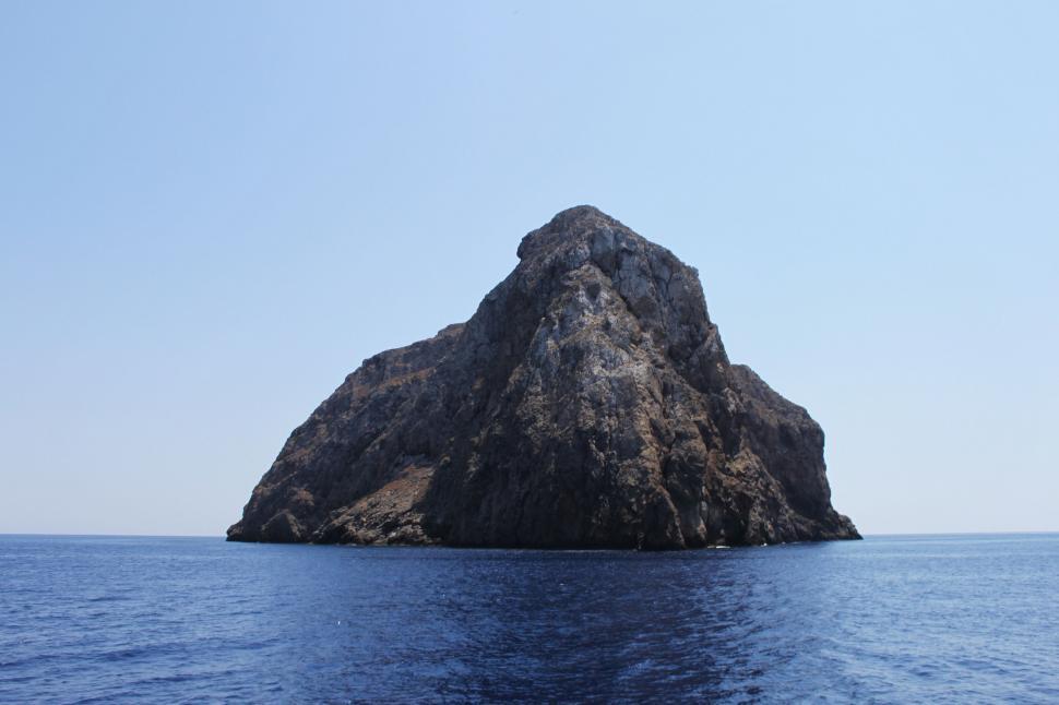 Free Image of Isolated rock formation emerging from the sea 