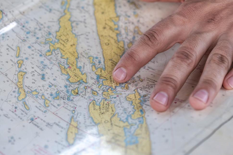 Free Image of Exploring maps with a fingertip 