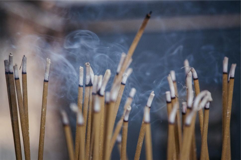 Free Image of Incense sticks burning with smoke 