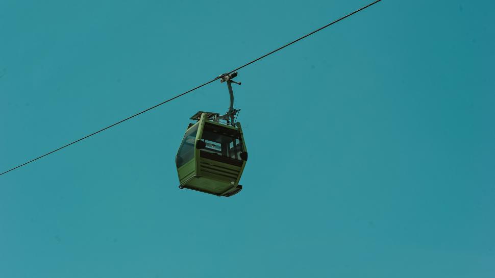Free Image of Solitary cable car against a clear sky 