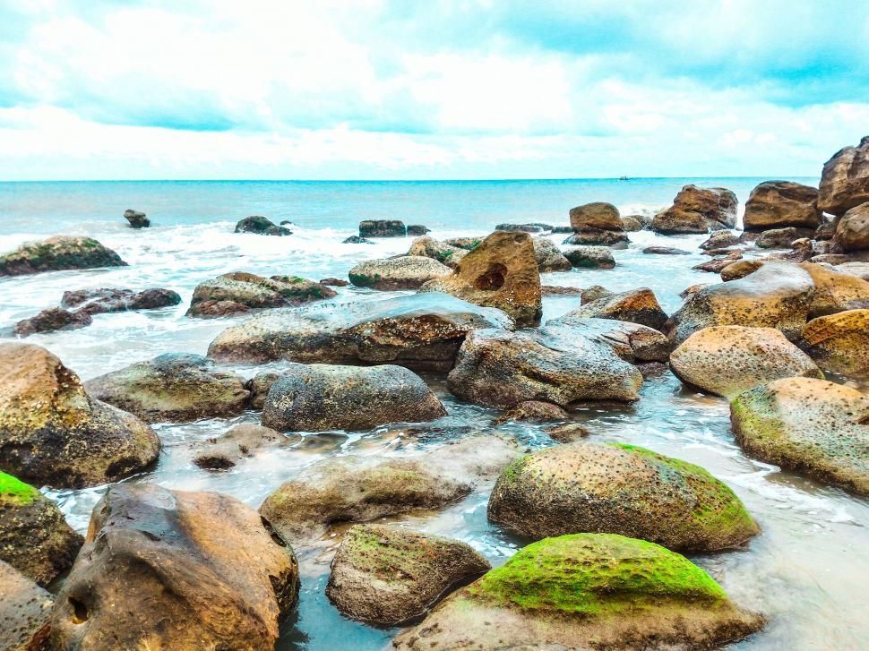 Free Image of Rocky shoreline with clear sea water 