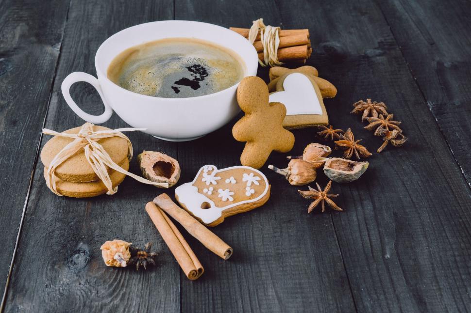 Free Image of Coffee cup and gingerbread cookies setup 
