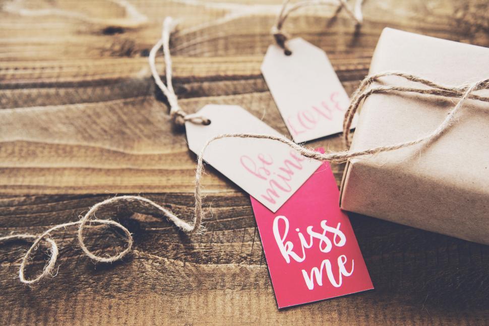 Free Image of Valentine s themed gifts and tags on wood 
