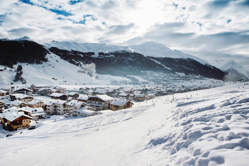 Free Image of Snowscape with village and distant mountains 