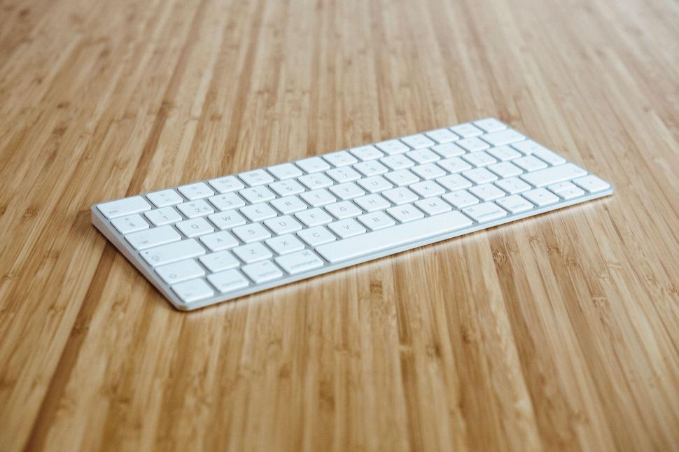 Free Image of Modern wireless keyboard on wooden table 