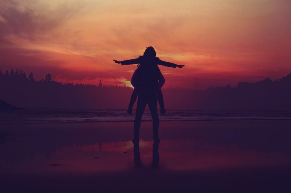 Free Image of Silhouette of a woman with arms outstretched 