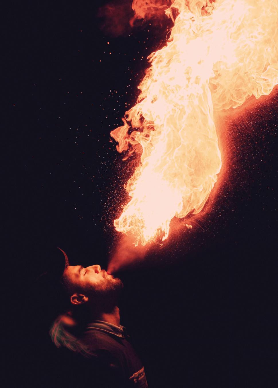 Free Image of Performing a fire breathing show in darkness 