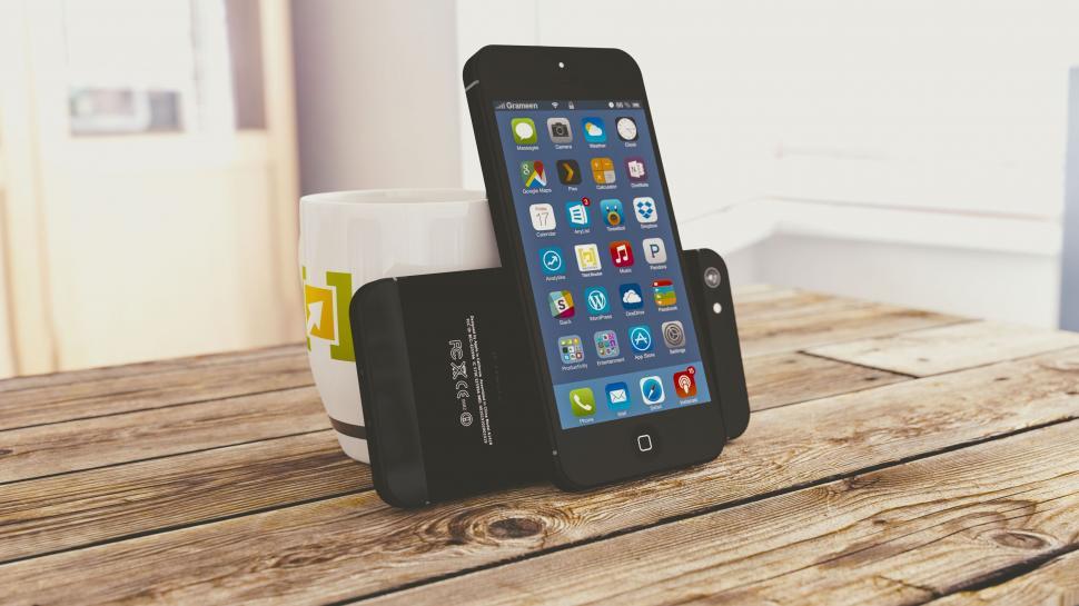 Free Image of Smartphone and Mug on Wooden Desk 