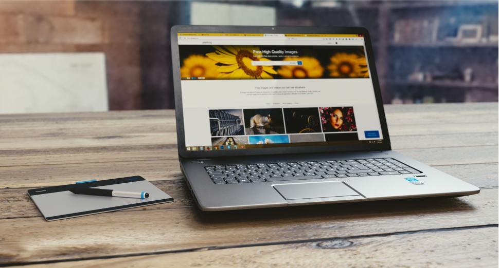 Free Image of Laptop displaying image stock website 