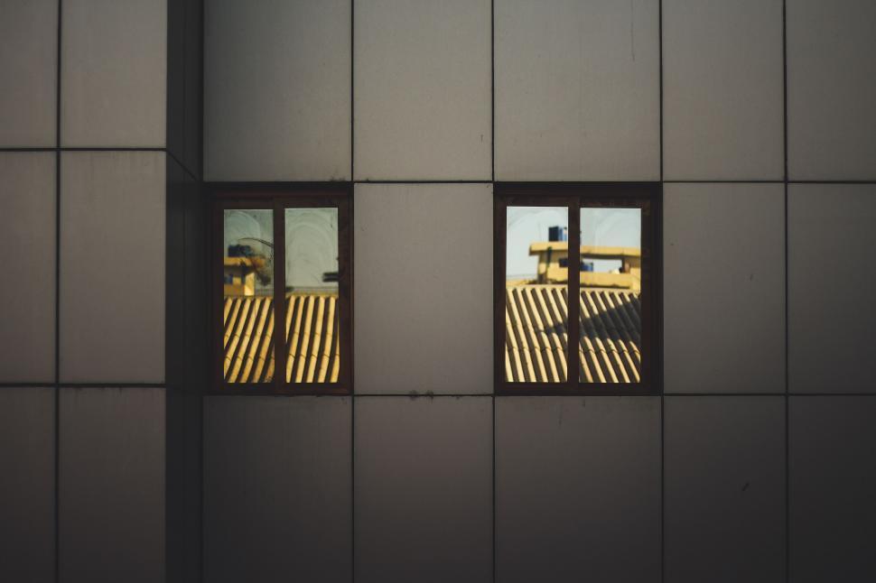 Free Image of Reflections of striped patterns in windows 