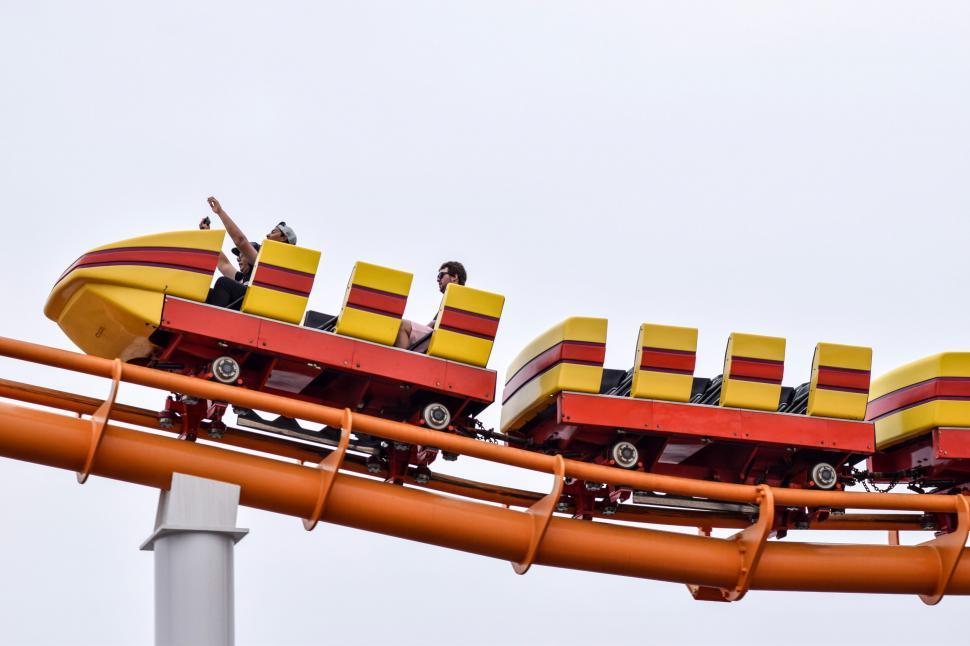 Free Image of Roller coaster ride in action with clear sky 