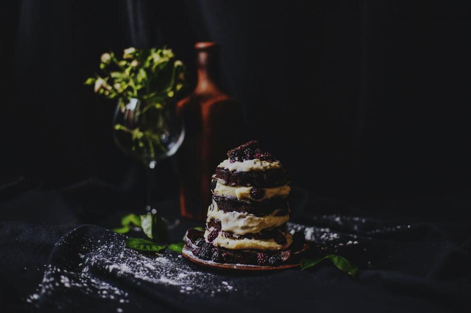 Free Image of Stacked chocolate cake with cream filling 