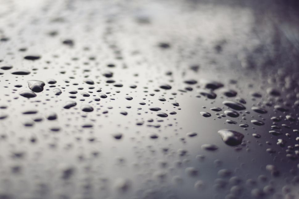 Free Image of Close-up photo of raindrops on surface 