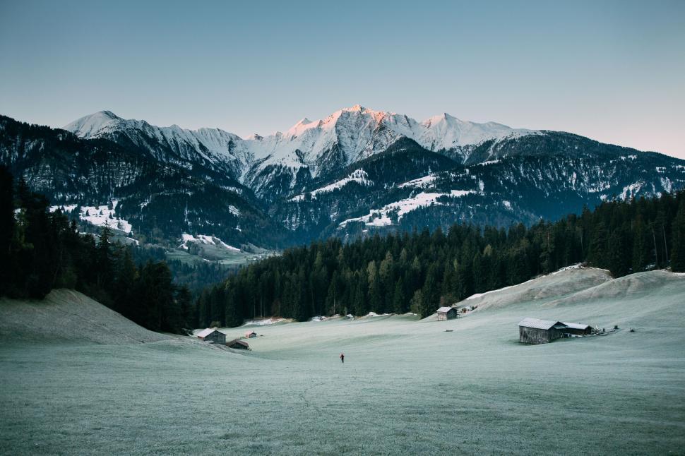 Free Image of Alpine landscape at dawn with frosted fields 