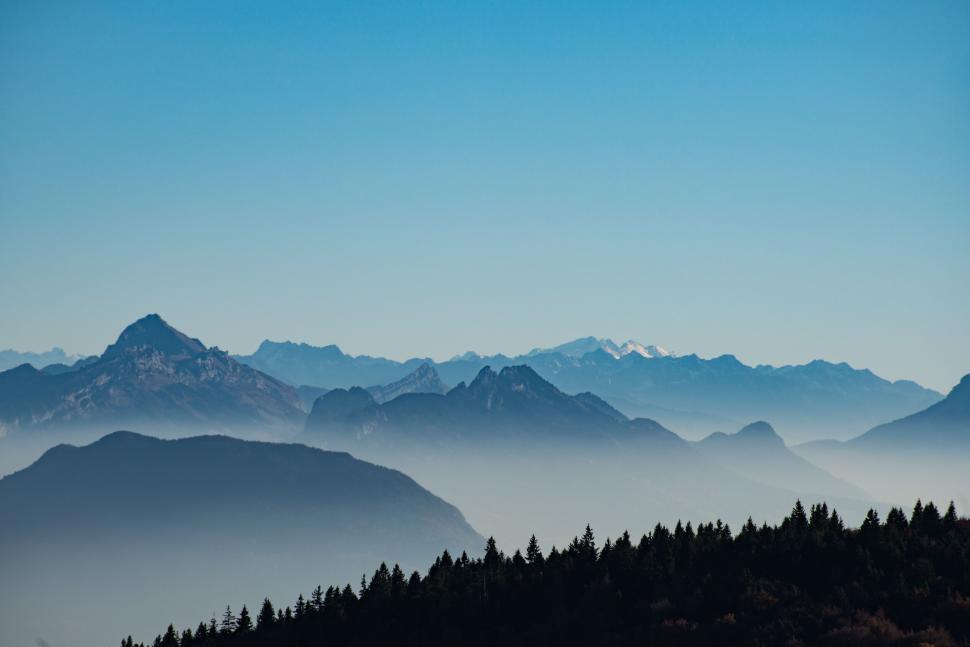 Free Image of Misty mountain peaks in a serene landscape 
