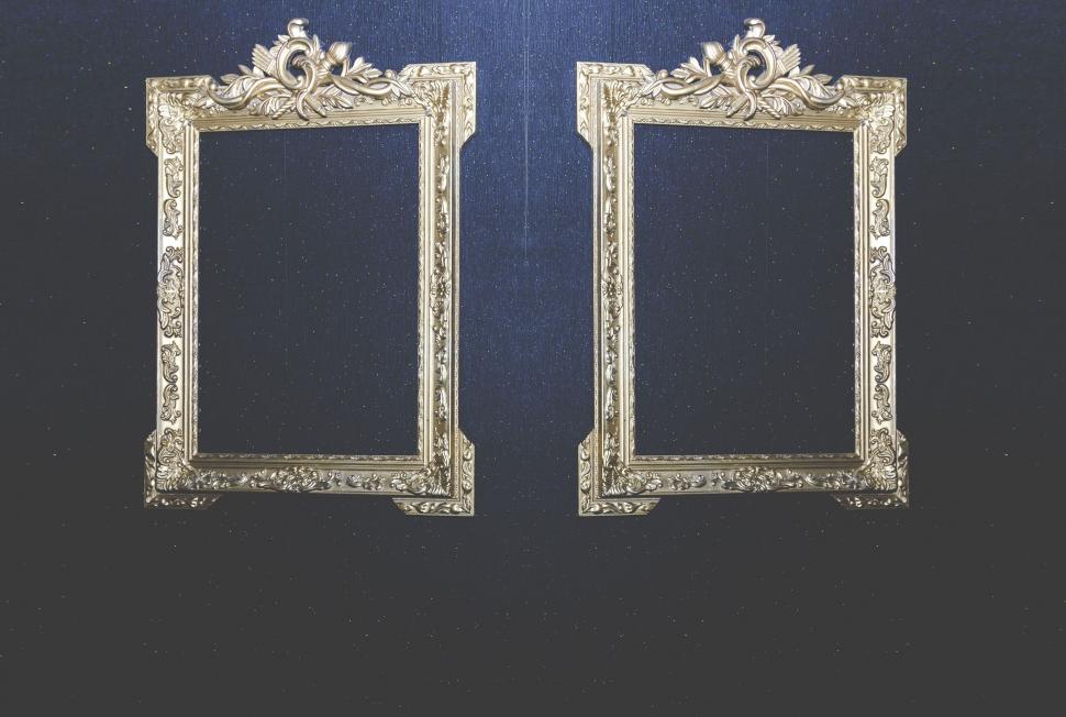 Free Image of Ornate empty picture frames on wall 
