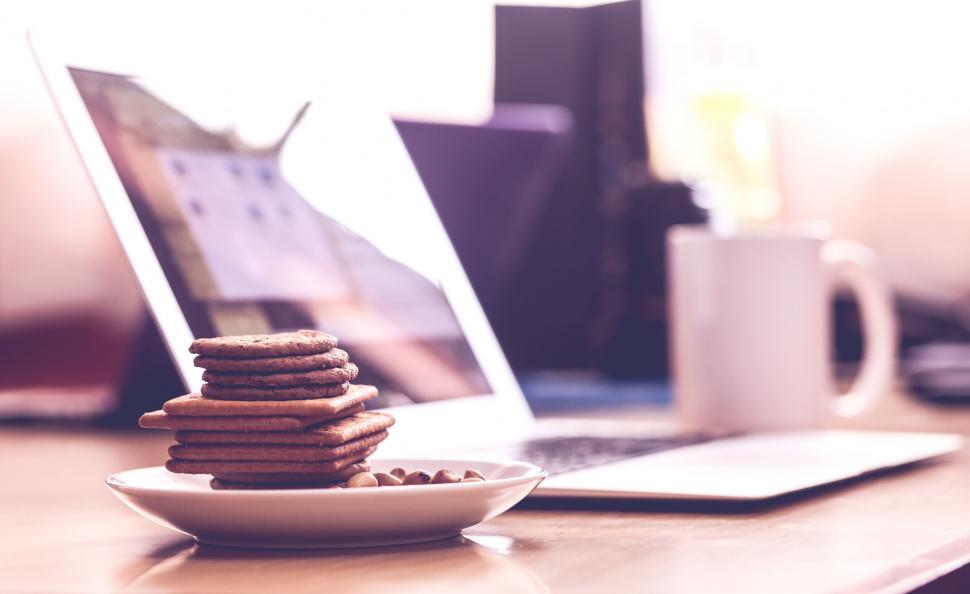 Free Image of Laptop and cookies on a modern workspace 