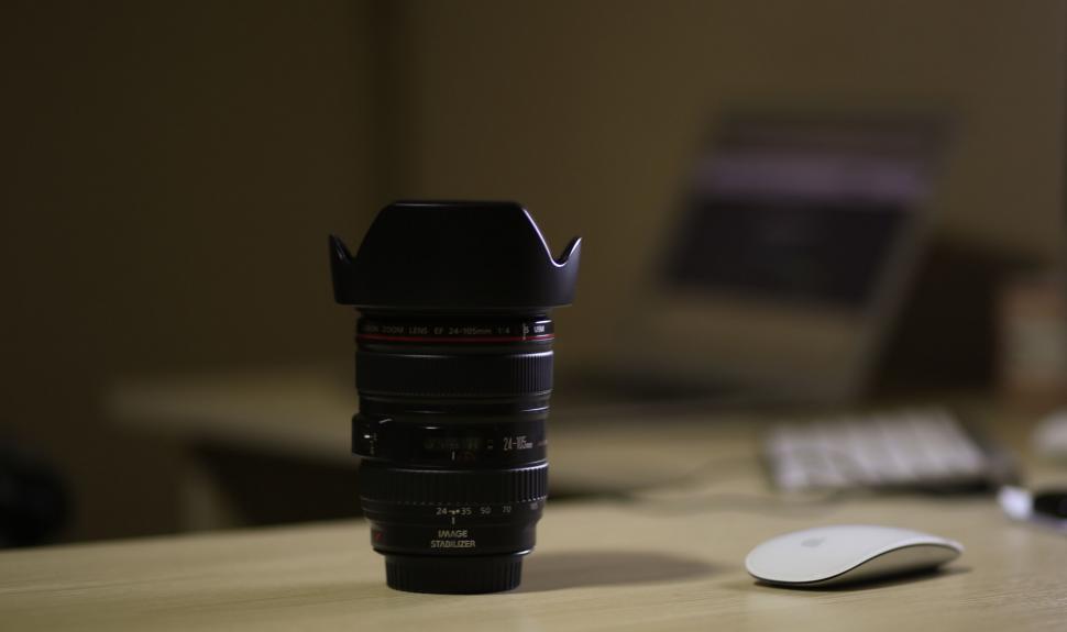 Free Image of Professional camera lens on office desk 