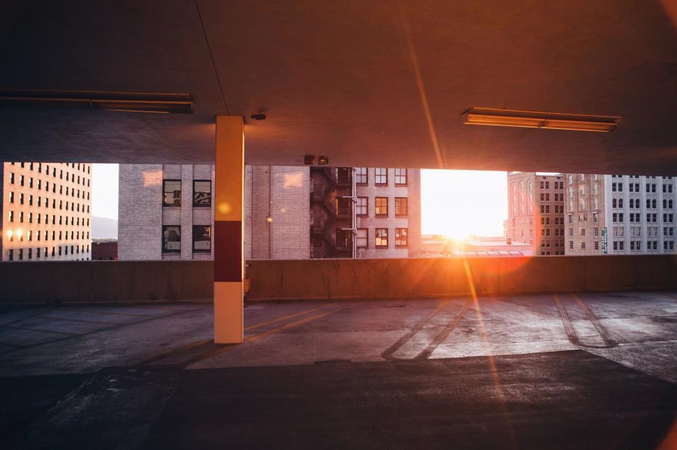 Free Image of Sunset framed by parking garage 