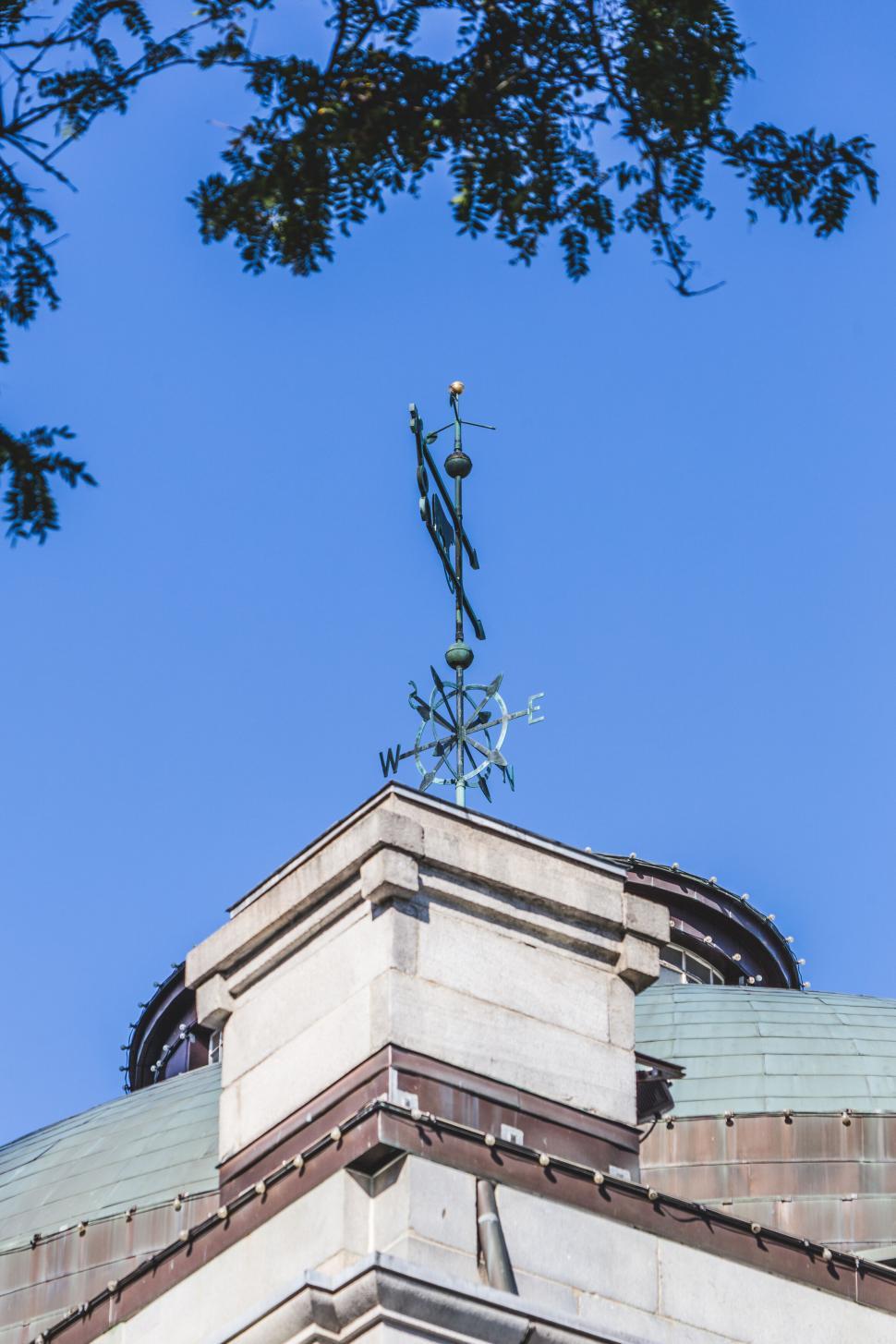 Free Image of Weather vane on top of a building 