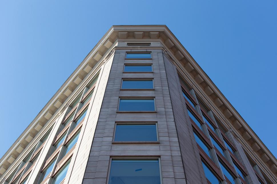 Free Image of Modern office building facade against blue sky 
