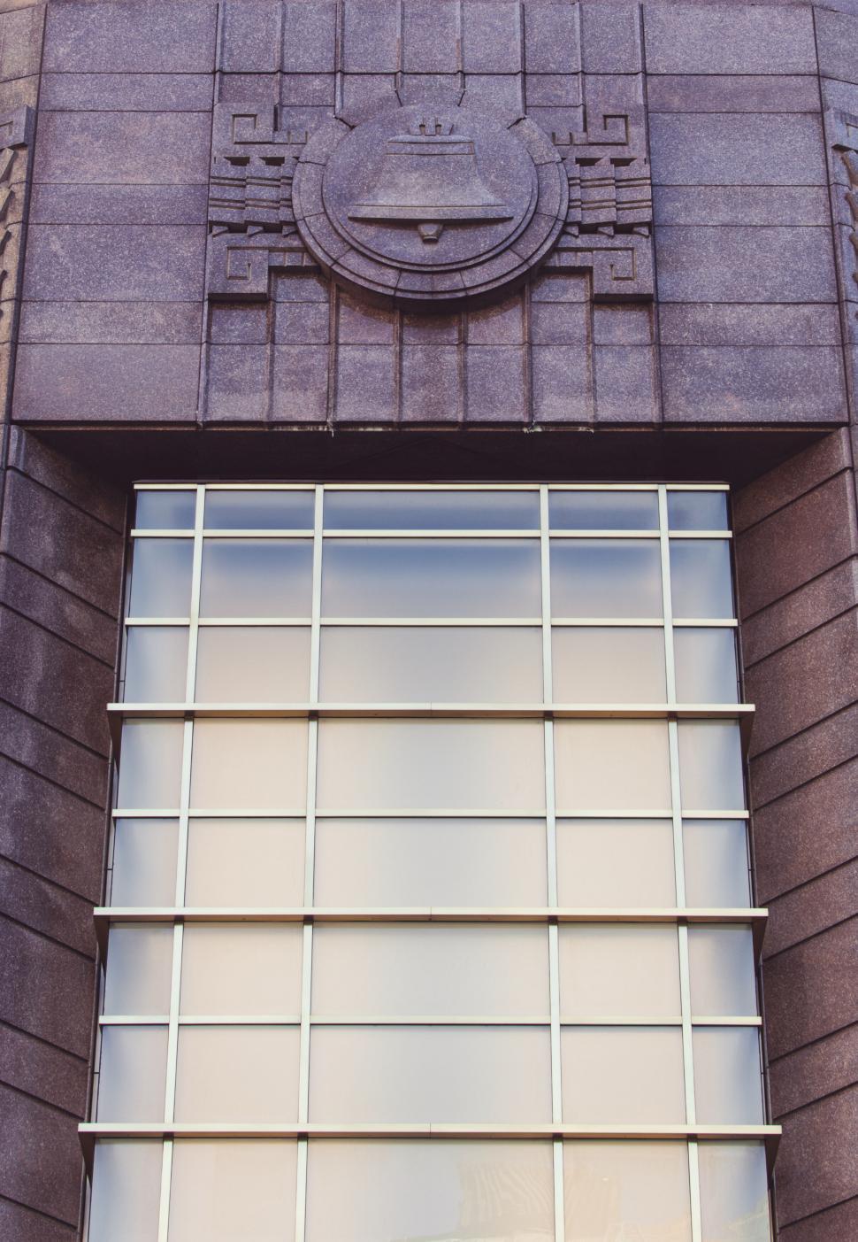 Free Image of Emblem and windows on an art deco building 