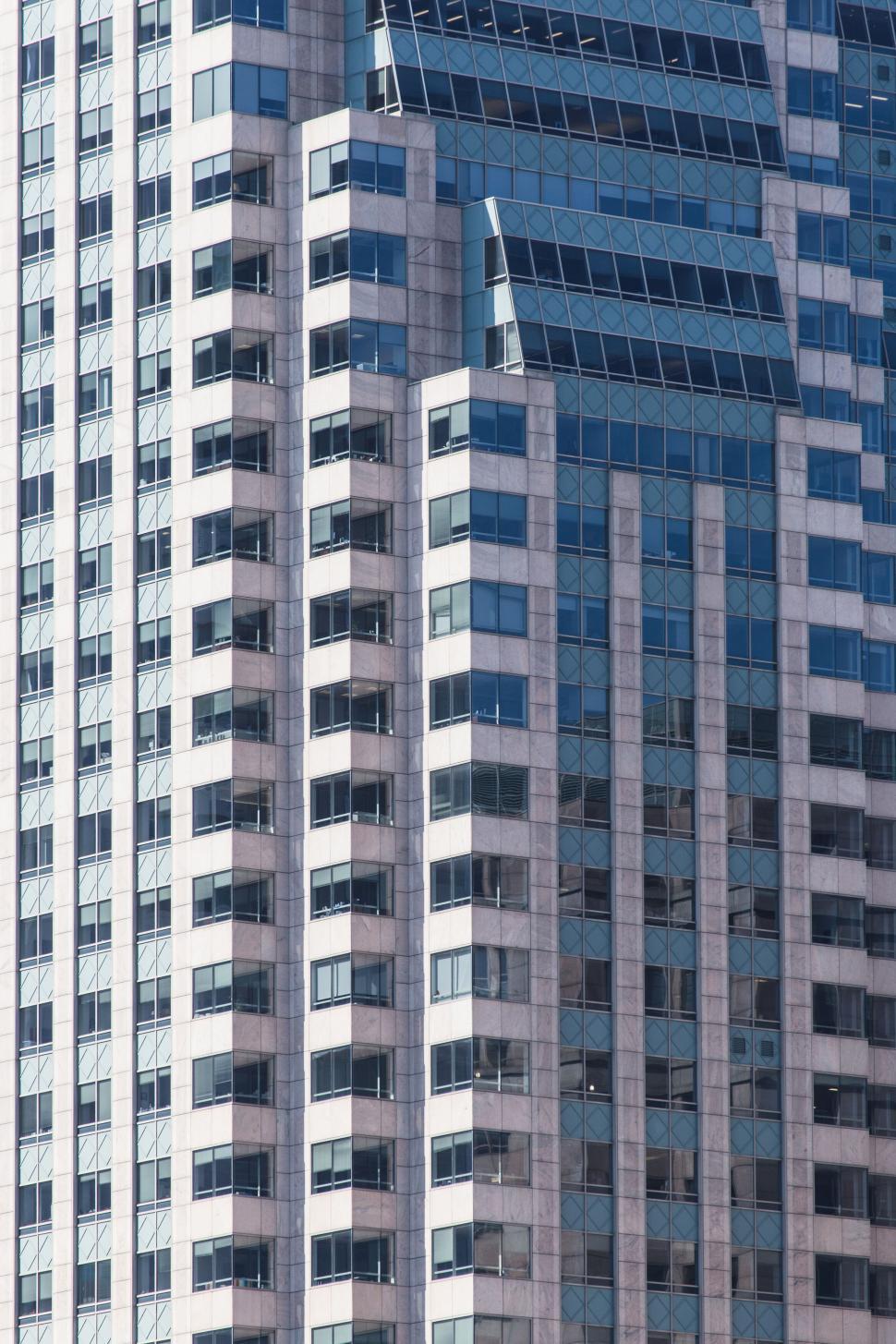 Free Image of Close-up of a skyscraper s windows and reflections 