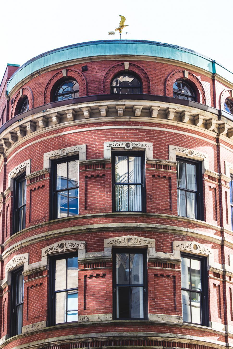 Free Image of Traditional red brick building with green dome 