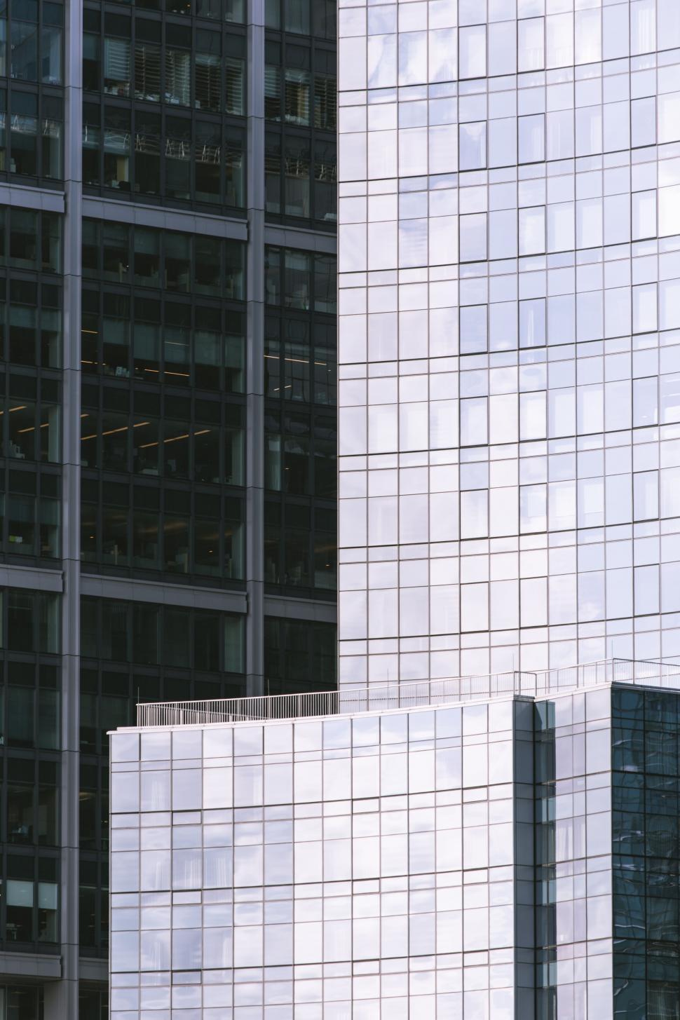 Free Image of Reflective blue glass in urban building design 