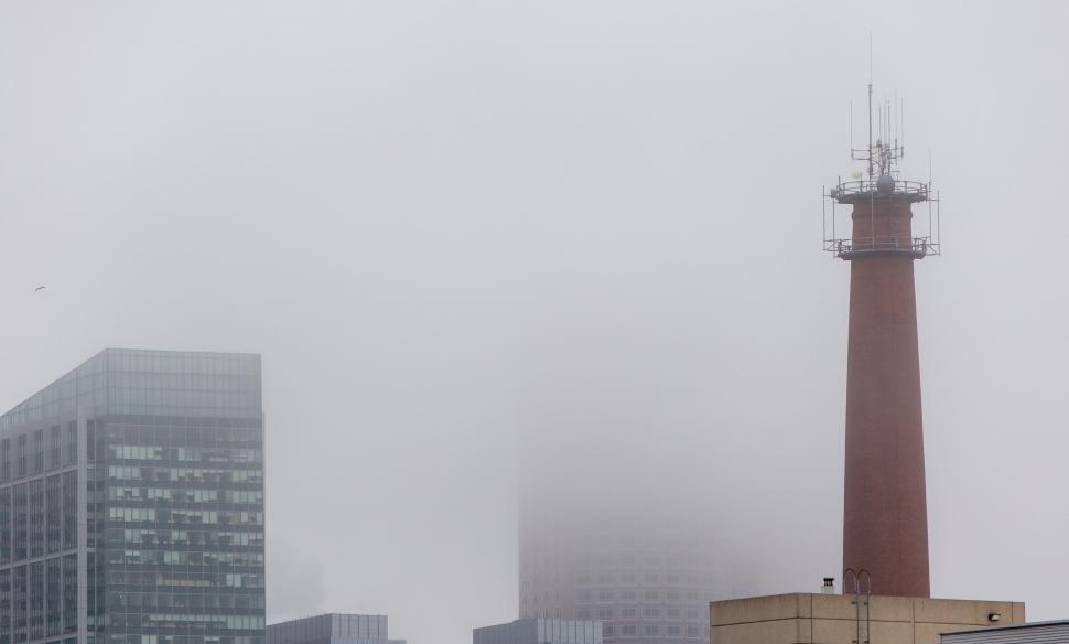Free Image of Foggy day with city buildings and tower 