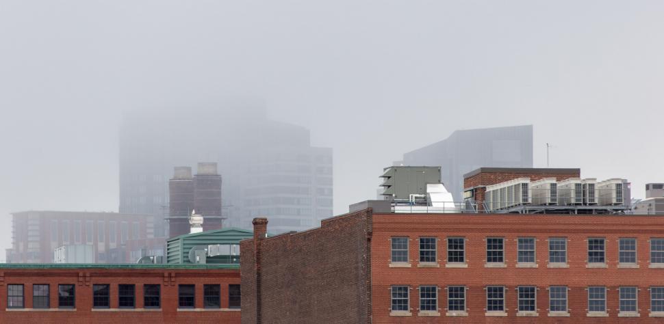 Free Image of Foggy cityscape with obscured buildings 