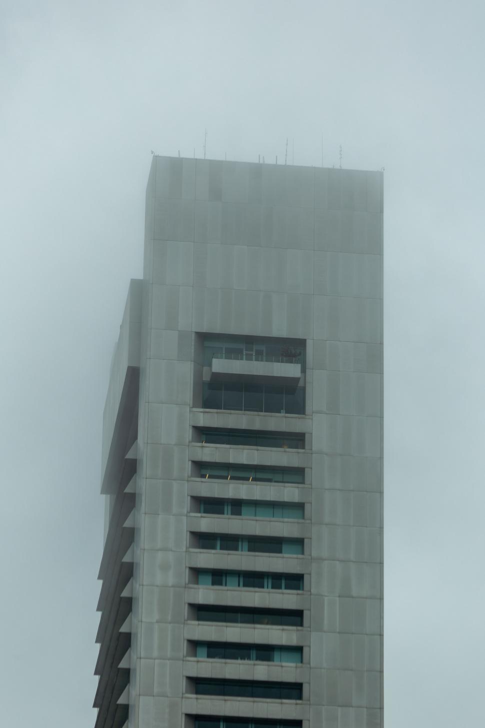 Free Image of Overcast sky over a gray building 