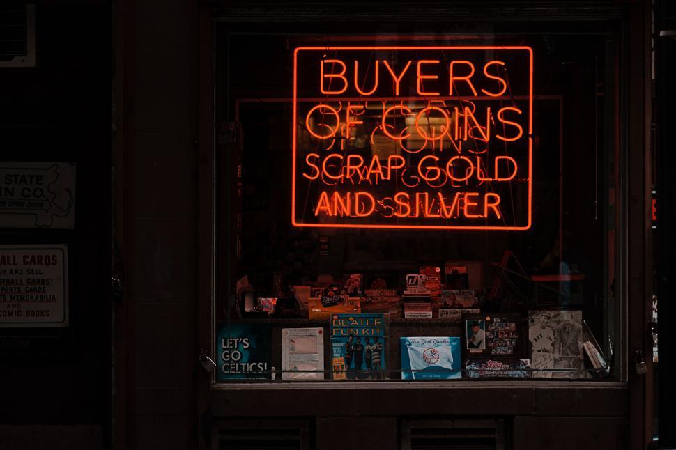 Free Image of Neon sign for buying coins and jewelry 