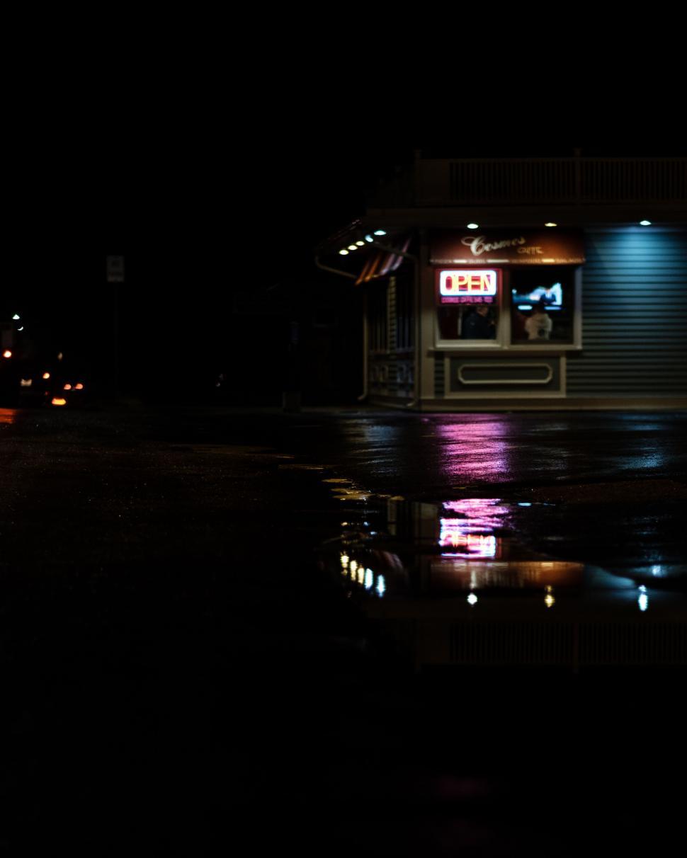 Free Image of Night view of a diner with neon open sign 