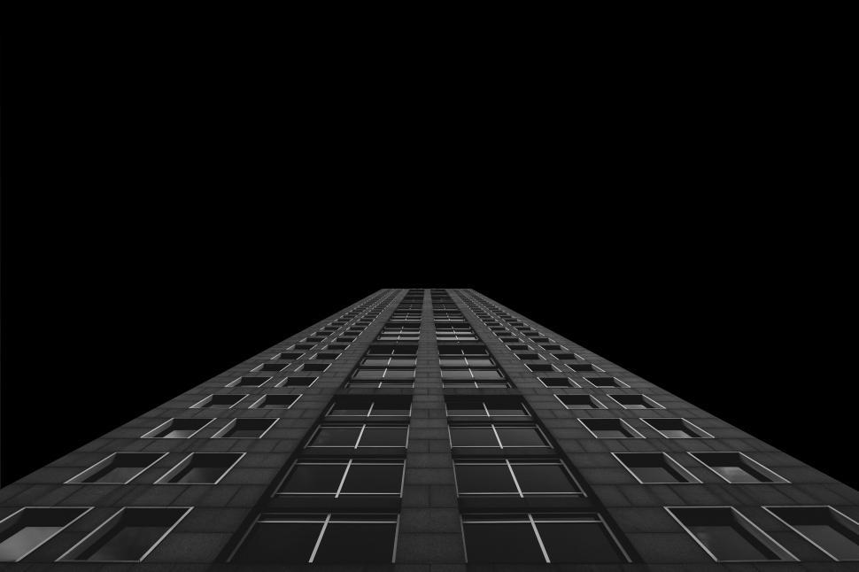 Free Image of Looking up a tall building in monochrome 