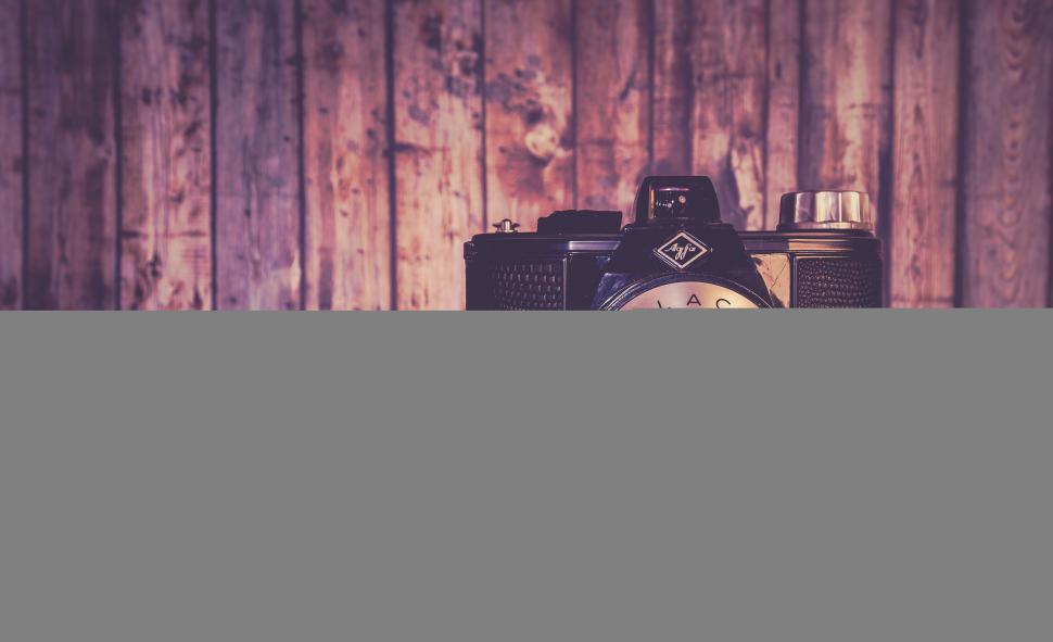 Free Image of Retro camera with purple flowers on side 