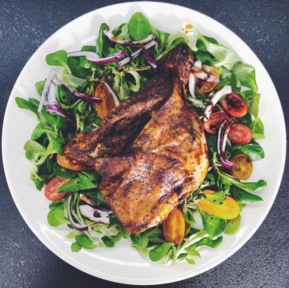 Free Image of Grilled chicken on fresh greens salad 
