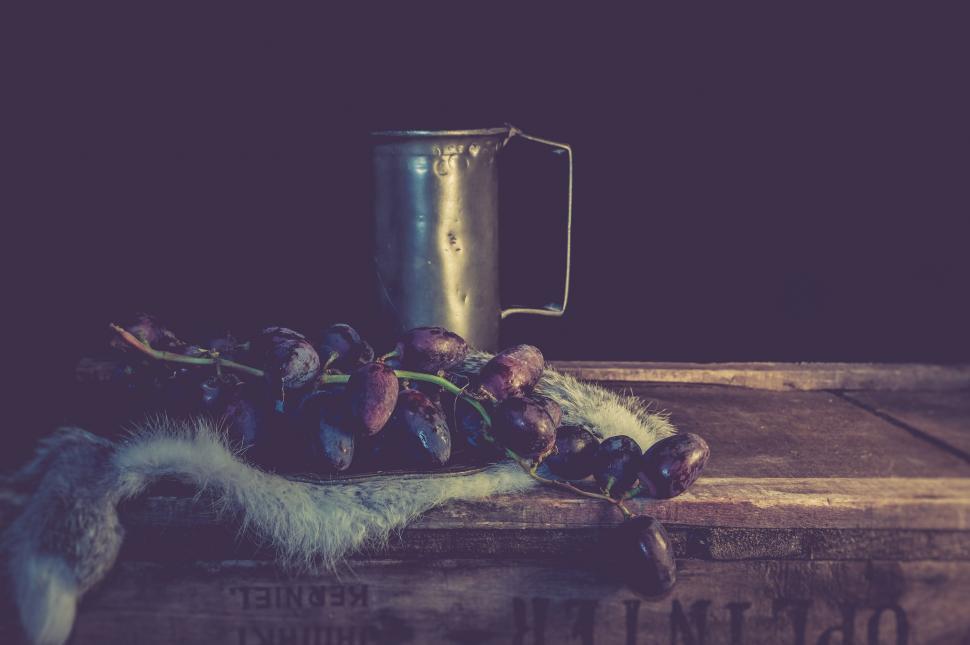 Free Image of Vintage mug with autumn fruits on rustic table 