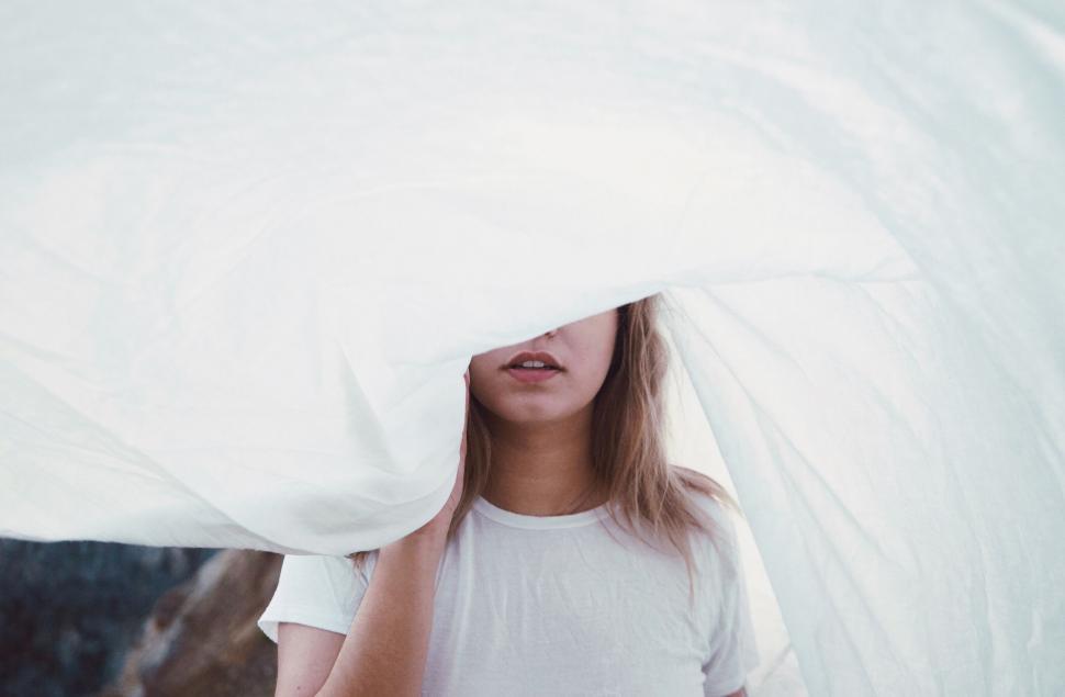 Free Image of Person covered by a translucent fabric 