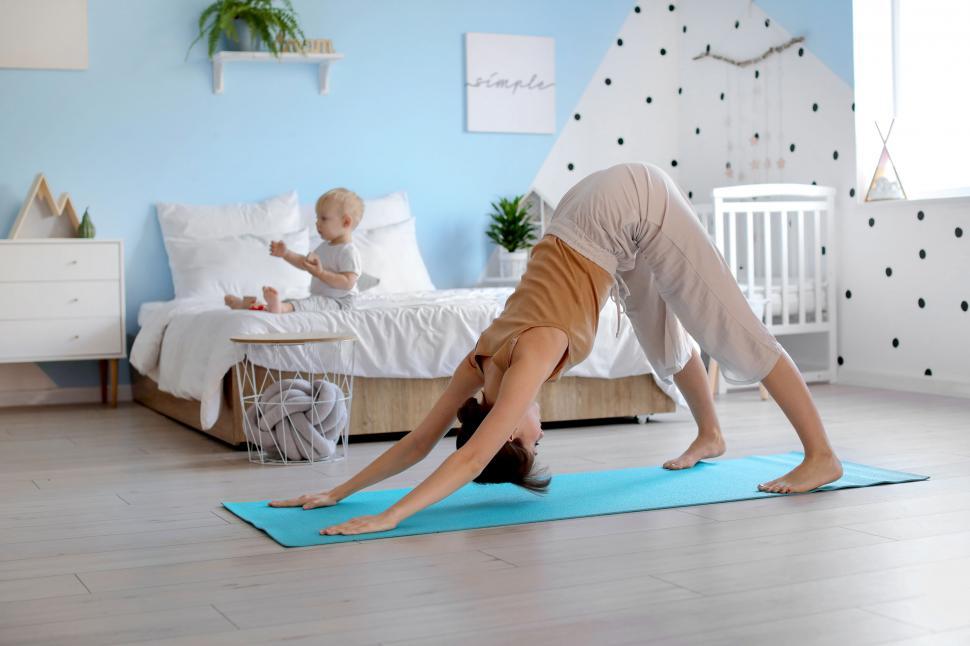 Free Image of Mother and child during home yoga session 
