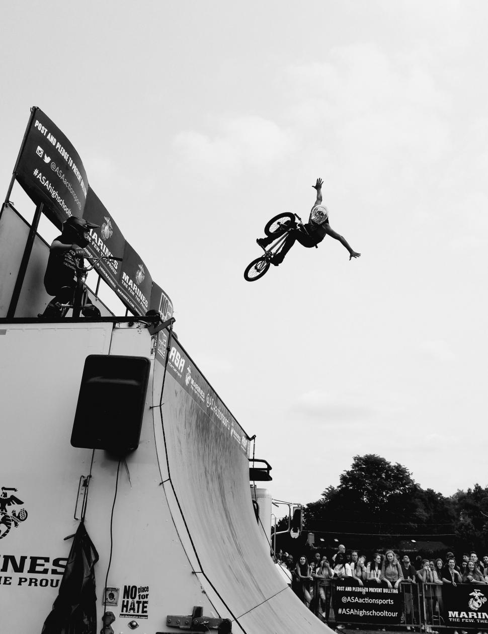 Free Image of BMX rider performs stunt at an event 