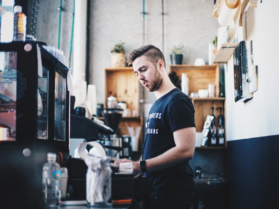 Free Image of Barista at work in an artisan coffee shop 