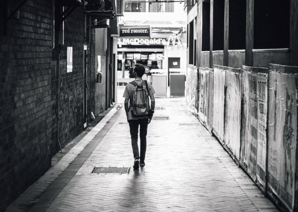 Free Image of Solitary person walking in urban alley 