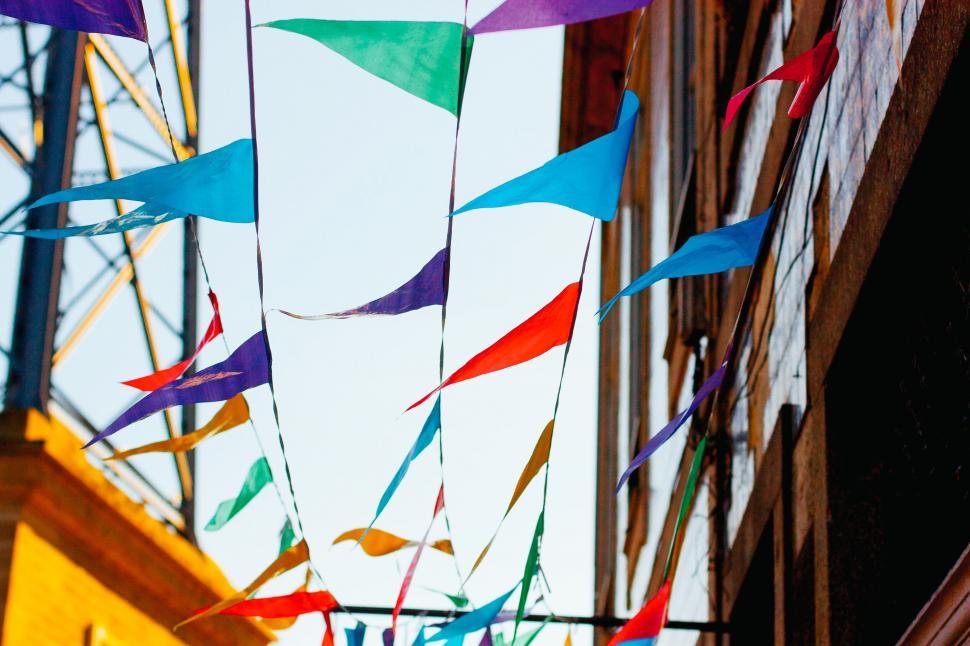 Free Image of Colorful flags fluttering on a sunny day 