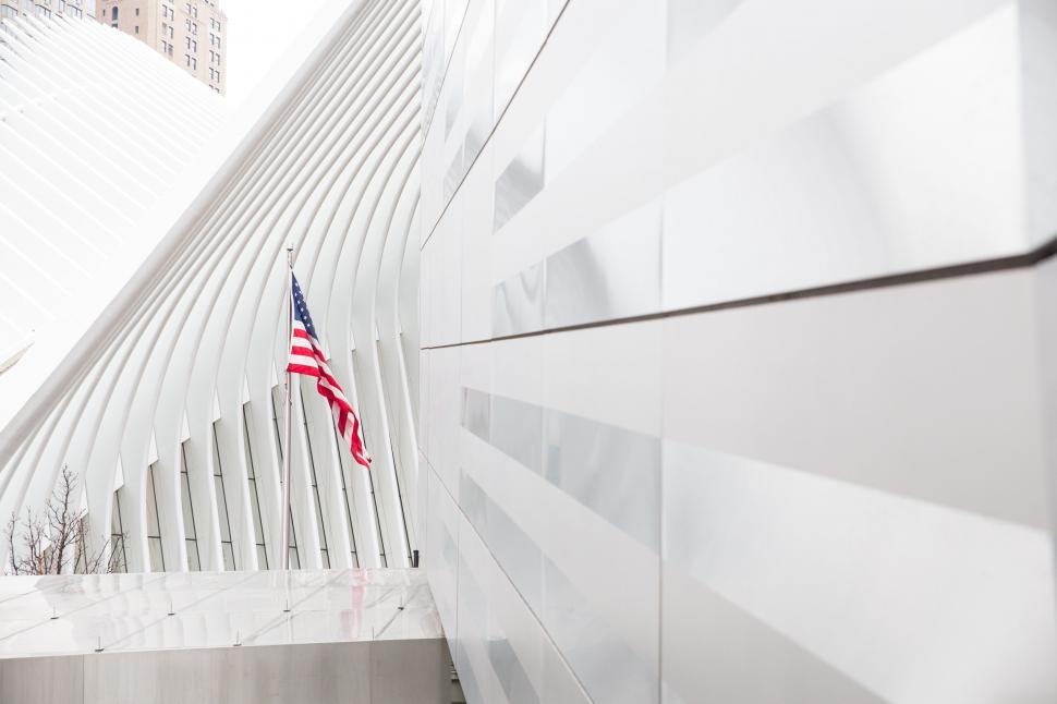 Free Image of American flag against modern architecture 