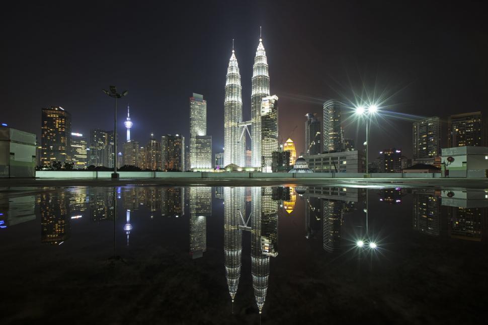 Free Image of Kuala Lumpur cityscape with Petronas Towers at night 