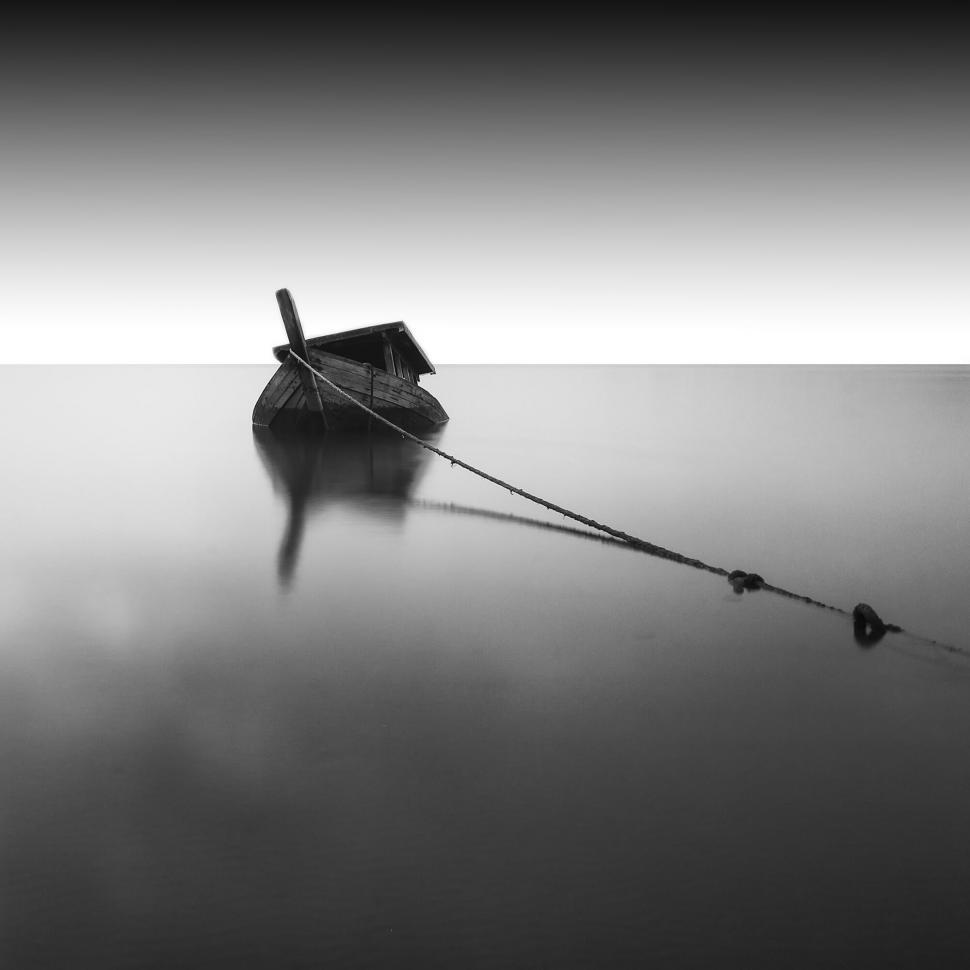 Free Image of Lonely boat in monochrome water scene 
